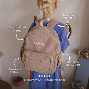 toddler boy wearing personalized backpack for daycare and preschool